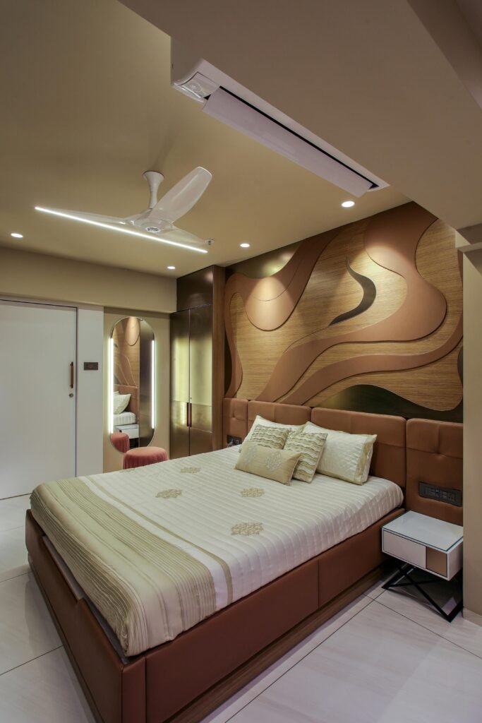 Elegant hotel bedroom with a stylish wood panel design and modern furnishings.